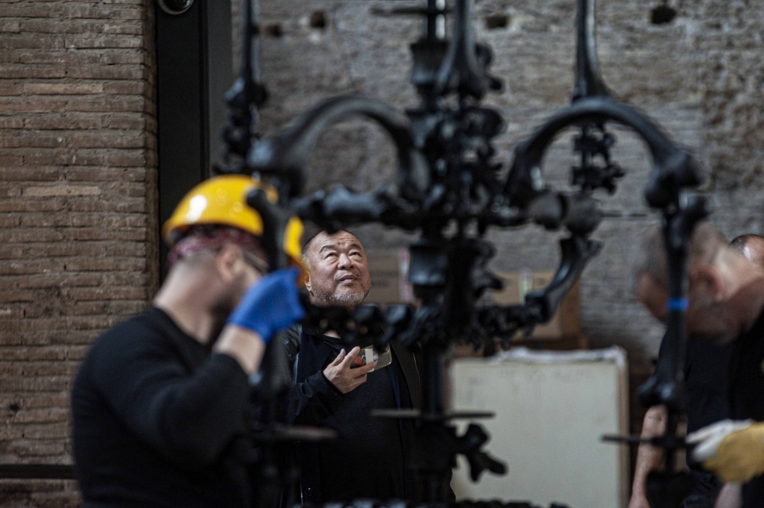 Ai Weiwei oversees the installation of La Commedia Umana at the Terme di Diocleziano